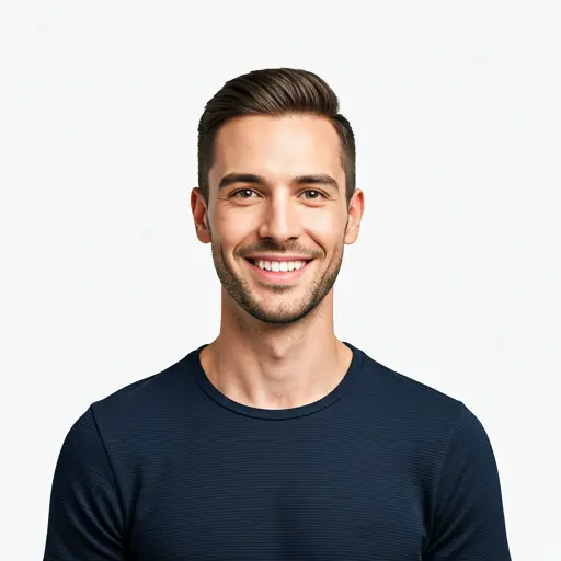 Man smiling warmly with a modern haircut